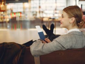 A Business Women sitting at airport - Get the Most Out of a Work Trip