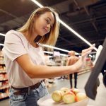 a women is using tablet in retailstore